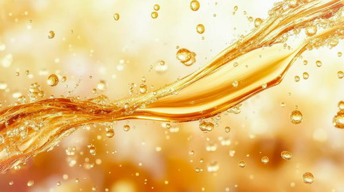 黄金色に輝く美容液の流動と有効成分を表現したテクスチャー