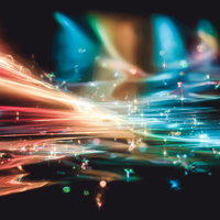 鮮やかな光の帯ときらめく光の粒の写真