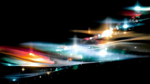 星屑のような光が舞うカラフルな抽象空間の光跡