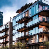 高級マンションとタワマンの夜景、黒と濃紺の高層建築が輝く都市風景の写真