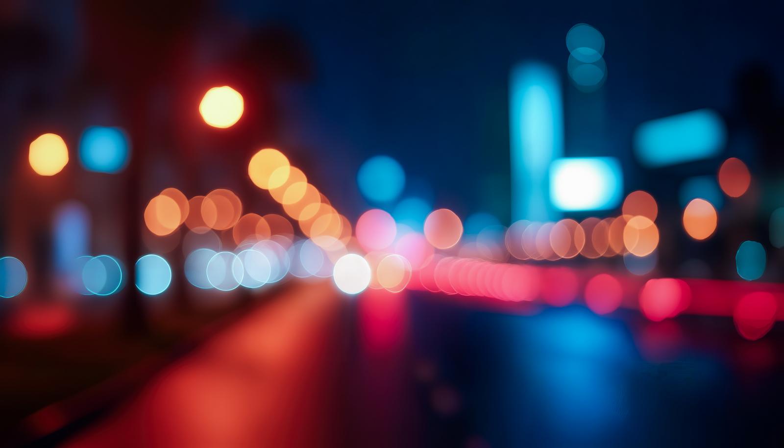 赤や青の玉ボケが広がる夜の街明かりのAI画像
