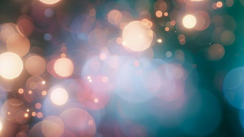 柔らかな輝きが浮かび上がるボケエフェクトと光の粒