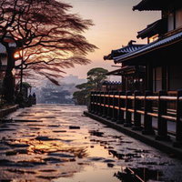 和風建築と夜明けの街並みを照らす朝焼けの道の写真