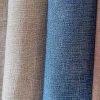 グレーからブルーまで4色の布地を並べたファブリック見本の写真