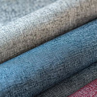 ベージュ・ブルー・レッドの3色リネン生地を重ねた織物見本の写真