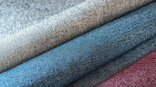 ベージュ・ブルー・レッドの3色リネン生地を重ねた織物見本