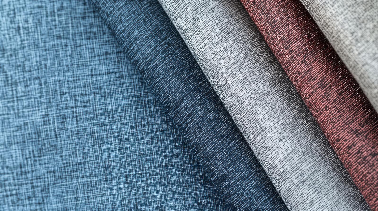 A fan of 7 fabric swatches in colors ranging from light blue to red