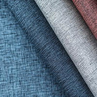 青・グレー・茶・白の布地を重ねた4色テキスタイルの写真