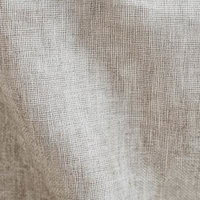 ベージュ色のリネン風布地の細かな織り目をクローズアップの写真
