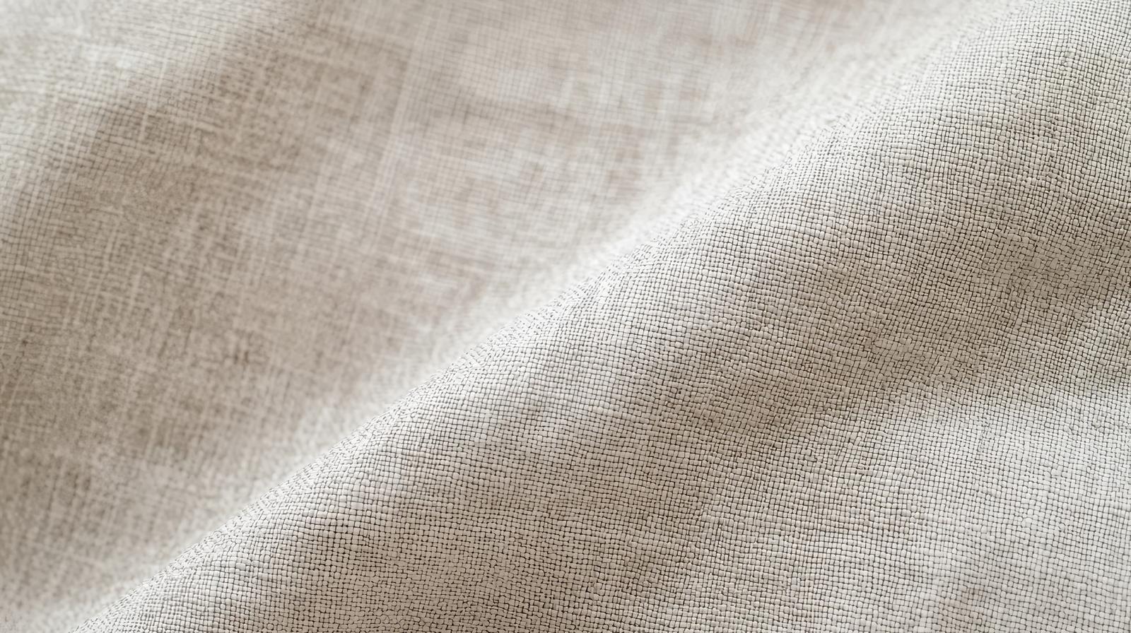 Beige cotton-linen style fabric with visible weave patterns along diagonal folds