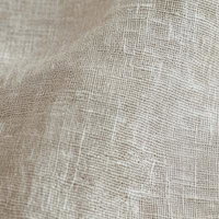 ナチュラルなリネン風生地の織り目と繊維テクスチャーの写真
