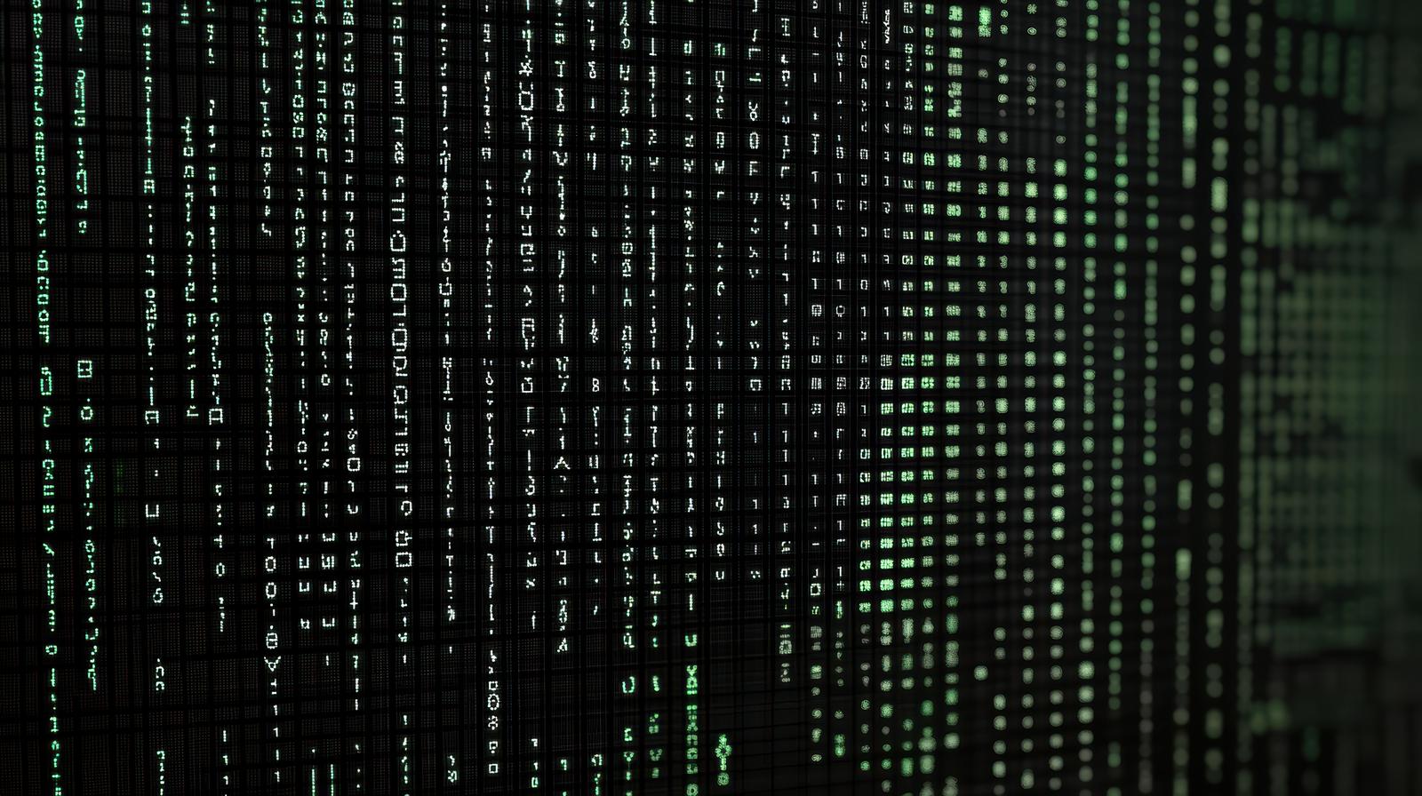緑色の英数字や記号が縦に流れ落ちるマトリックス風の背景