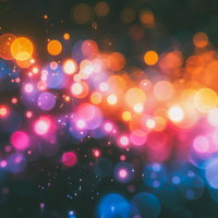 カラフルな光の玉が浮かぶボケ表現のグラデーション背景の写真