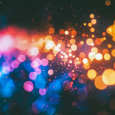 カラフルな光の玉が広がる背景の写真