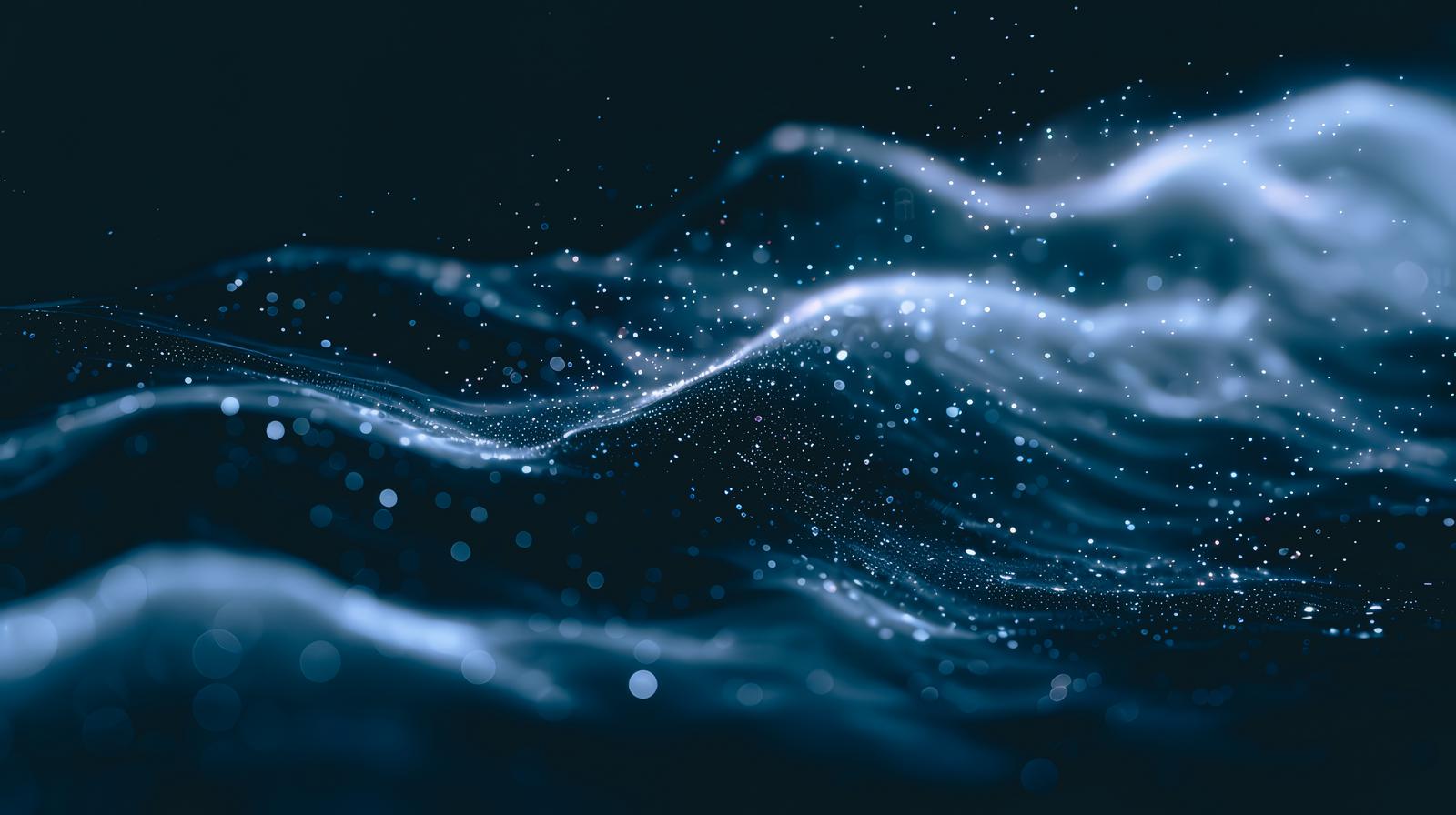 暗闇の中を光の粒子が波状に浮かんで流れる