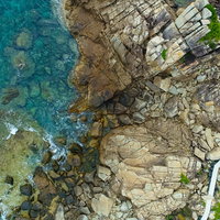 徳之島ムシロ瀬の花崗岩海岸をドローンで上空から撮影の写真