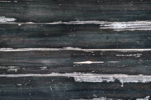 グレーと黒に白い筋が走る古い木の板のテクスチャー背景