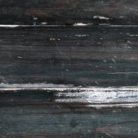 黒い木板の経年劣化を捉えたテクスチャーの写真