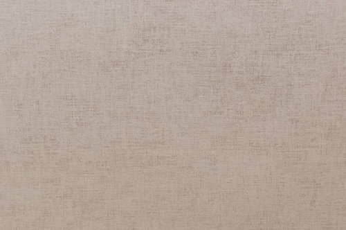 細かい織り目が見えるベージュの布生地のテクスチャー