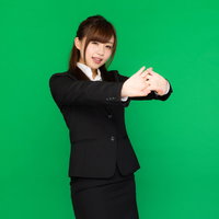 肩こりが酷くて両手を前に出して伸びをする事務のビジネスウーマン（グリーンバック）の写真