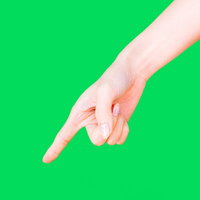 下に指をさす女性の手、グリーンバック背景の写真