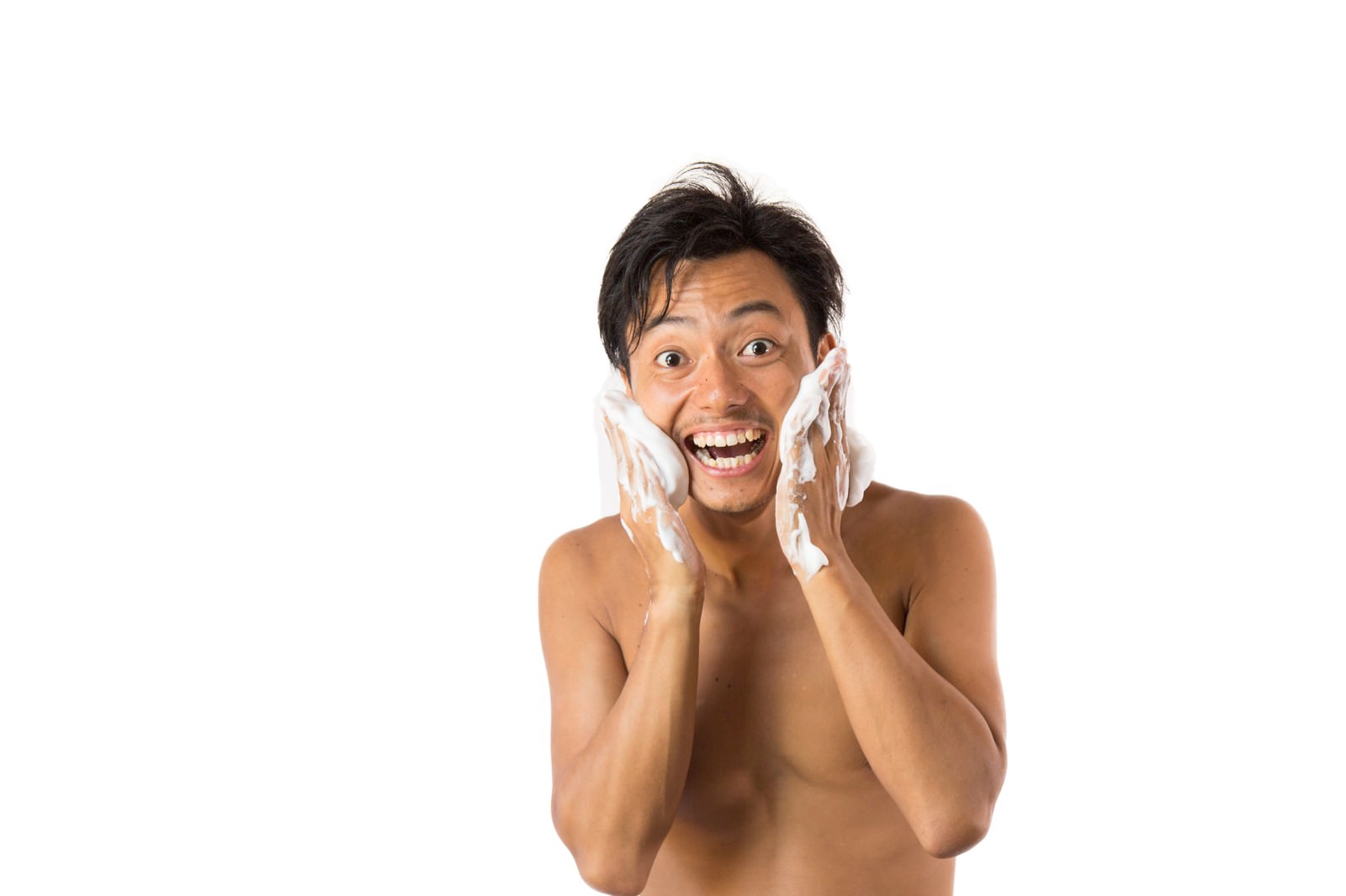 両手を頬に当てて驚いた表情を見せる男性［モデル：藤沢篤］