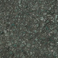 大小の砕石が敷き詰められた路面テクスチャの写真