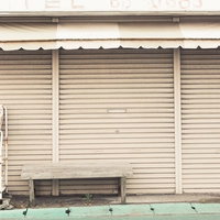 元書店の閉じたシャッター - 大原中央商店街の空き店舗の写真