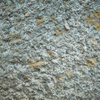 所々に土が付着するコンクリート壁のテクスチャの写真