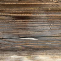 濃い色の節がある木目テクスチャーの木材板の写真