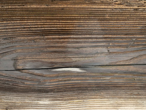 濃い色の節がある木目テクスチャーの木材板