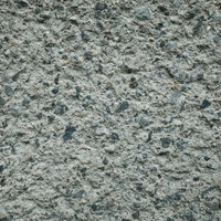 砂利が詰まったコンクリートのテクスチャーの写真