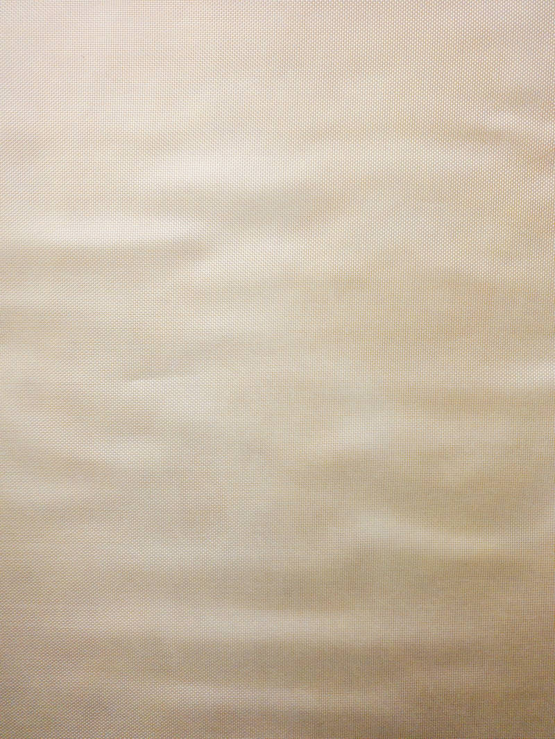 ベージュ色の布のテクスチャー、繊維の質感が見える