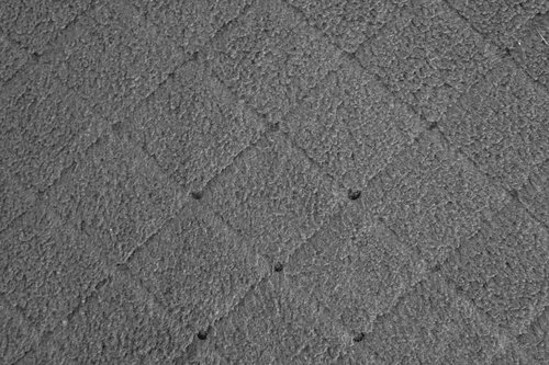 吹付けタイル仕上げのグレー外壁のテクスチャ