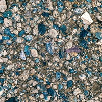 地面にめり込む小石のテクスチャーの写真