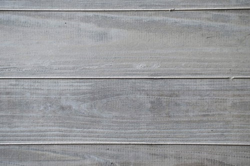 グレーに塗装された木の塀の木目テクスチャー