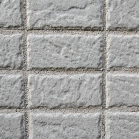 新築の外壁に規則的に並ぶグレーのタイル壁の写真