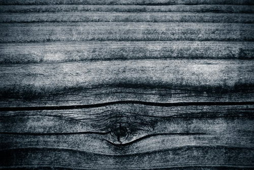 古い木板の木目と節のテクスチャー