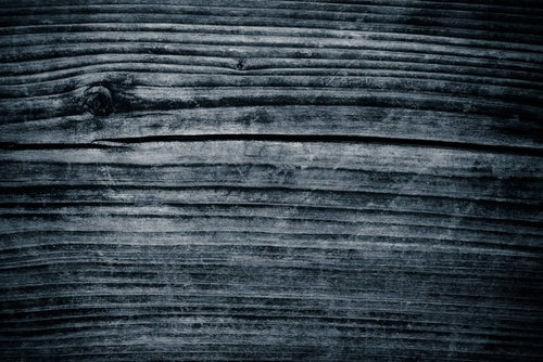 古い木の板に刻まれた節と木目のテクスチャ