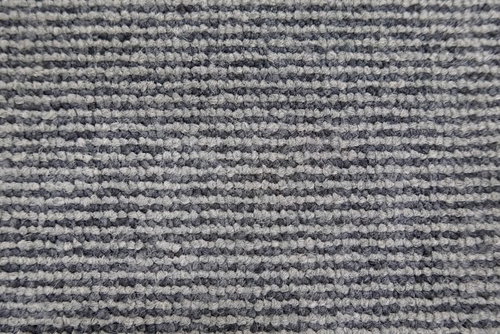 グレーのカーペットの細かな繊維テクスチャ