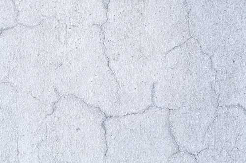 補修済みのヒビがある外壁テクスチャーのコンクリート壁面