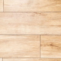 薄い黄褐色から濃い茶色の木目調の床材フローリングの写真