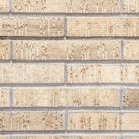 新築の外壁タイル・クリーム色のテクスチャーの写真