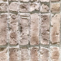 粗い質感の外壁タイル表面のエイジングテクスチャーの写真