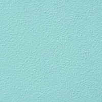 淡いミントカラーに塗られた外壁のテクスチャーの写真