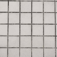 グレー色の石材タイルと目地のテクスチャ、正方形パターンの写真