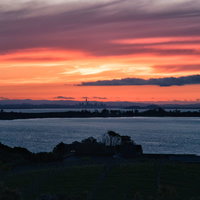 オークランドの夕焼けと海岸線（ニュージーランド）の写真