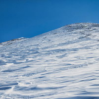 風紋に埋め尽くされる朝日岳（北アルプス）の写真