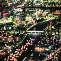 丸ボケで表現した都市夜景 - ロマンチックな光の粒の写真