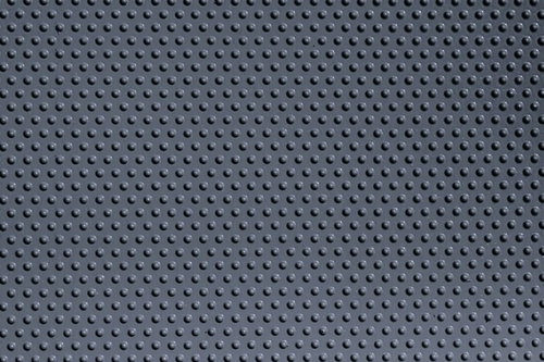 細かい粒の集合したグレーのプラスチック板（テクスチャー）